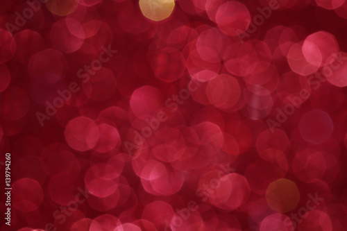Red glittering christmas lights. Blurred abstract background.