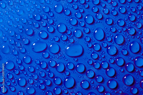 Water drops on the blue background