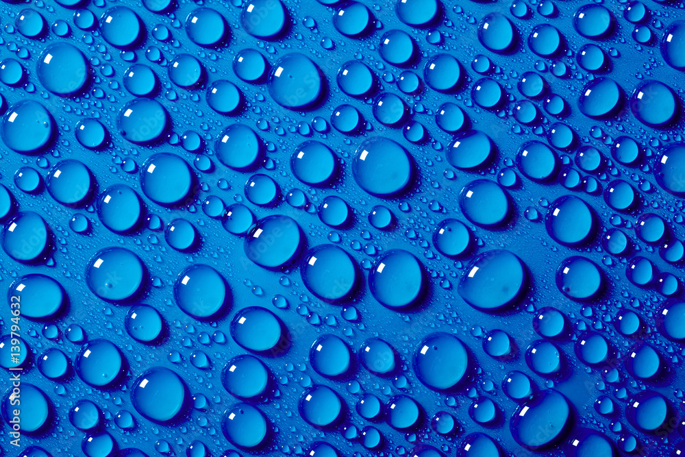 Water drops on the blue background