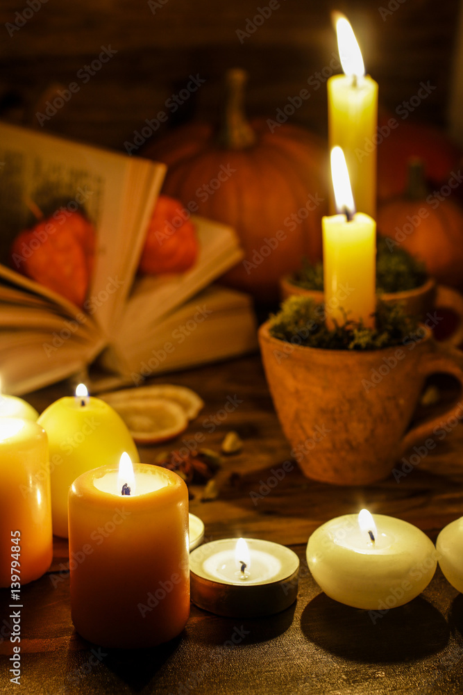Autumn decorations: candles on wooden table in the evening. Autumn decorations: candles on wooden table in the evening.