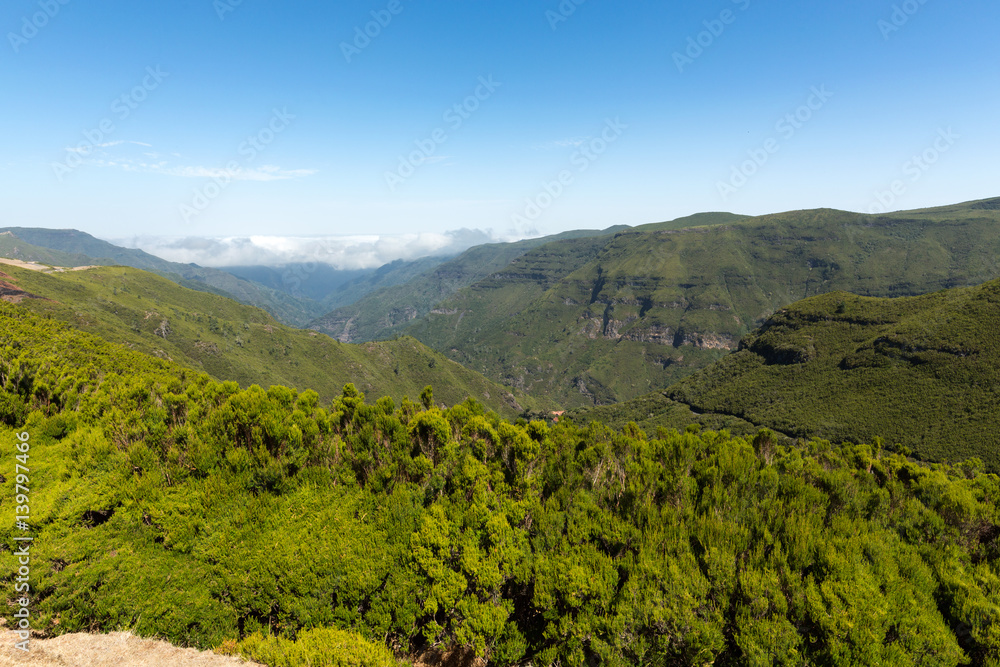 Picturesque aerial panorama of mountains and rainforest hills on Madeira island, Portugal.