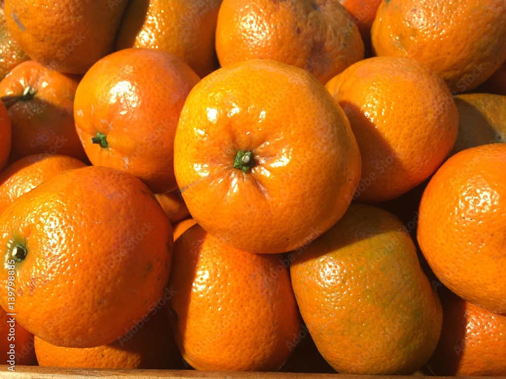 heap of Chinese orange stacked up. Lot of orange on sale in supermarket. Orange pattern for texture and background. heap of Chinese orange stacked up. Lot of orange on sale in supermarket. Orange pattern for texture and background.