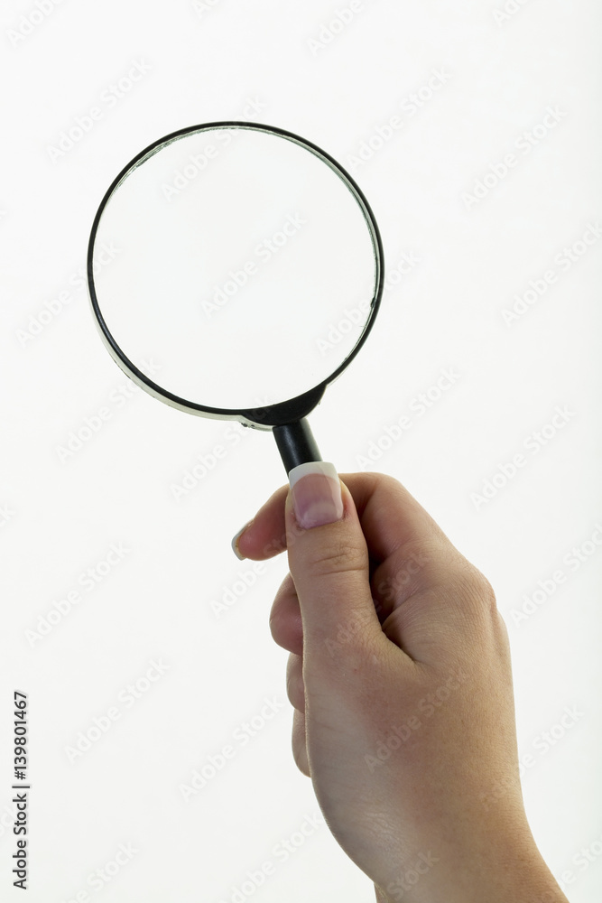 Hand mit einer Lupe Hand mit einer Lupe