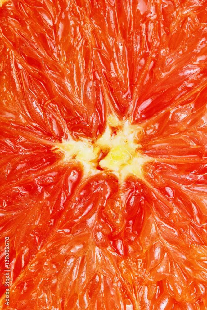 Abstract background with citrus-fruit of grapefruit slices. Close-up. Studio photography.Macro Abstract background with citrus-fruit of grapefruit slices. Close-up. Studio photography.Macro
