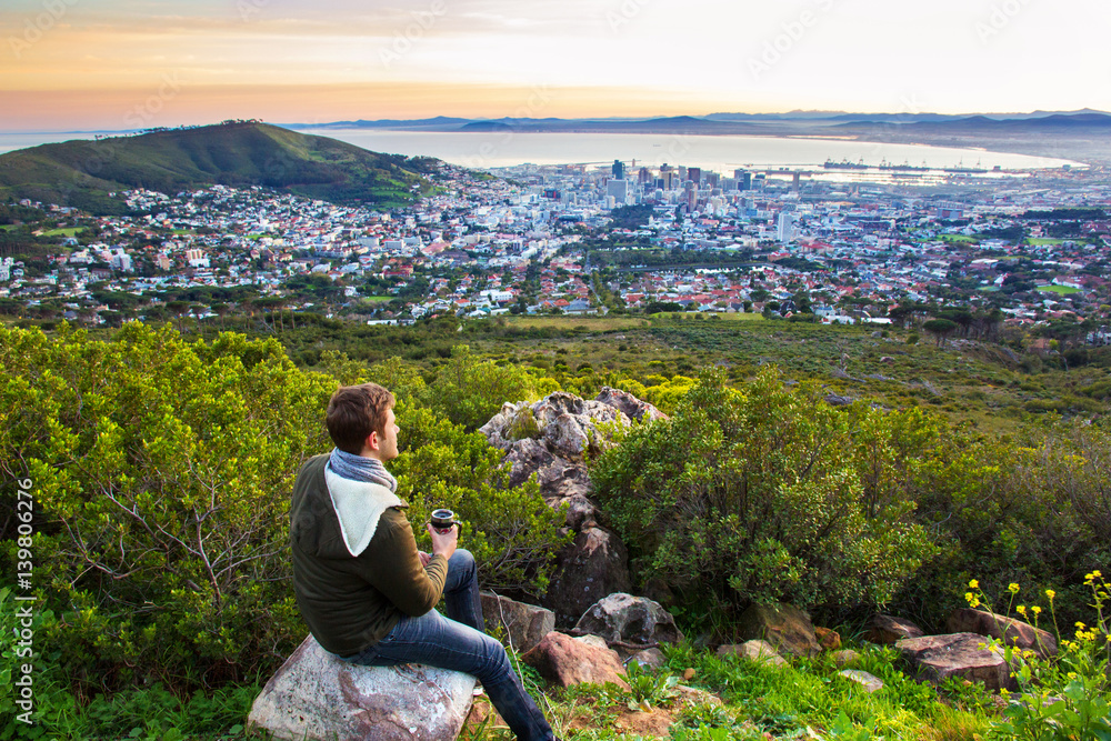 Fototapeta premium Young man looking at view of the city of Cape Town