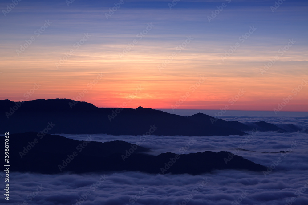 mountains under mist in the morning sunrise at Doi Phu Kha National Park in Nan ,Thailand