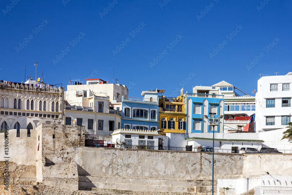 Morocco - Tanger houses near ancient fortress in old town.