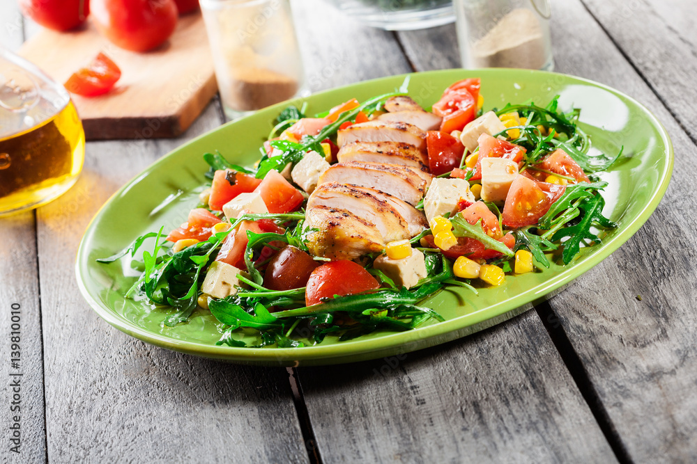 Fresh salad with chicken breast, arugula and tomato Fresh salad with chicken breast, arugula and tomato