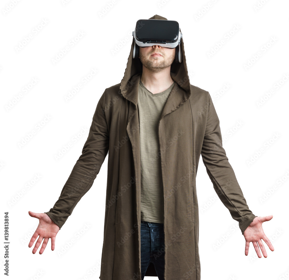 Isolated portrait of an young man in a hoodie wearing vr glasses. Isolated portrait of an young man in a hoodie wearing vr glasses.