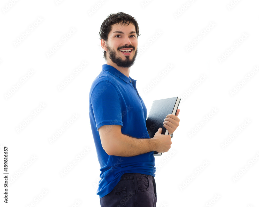 Young student holding books and smiling. Young man wearing blue polo shirt, white background, copy space. Young student holding books and smiling. Young man wearing blue polo shirt, white background, copy space.