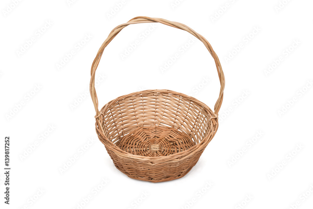 Fototapeta premium Empty wicker basket with long handle, isolated on white background