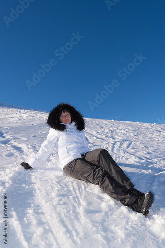 middle-aged brunette on a background of mountains