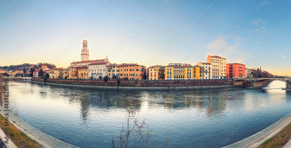 historical quarter of Verona, panorama from river on Duomo Cathedral at sunrise