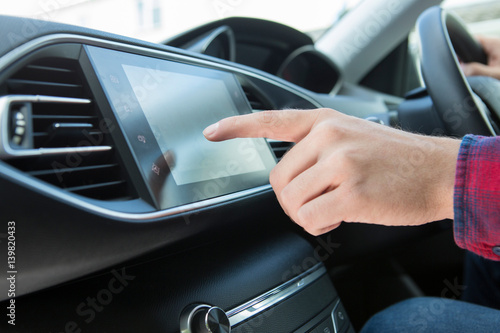 Close Up Of Driver Using Touchscreen In Car © Daisy Daisy