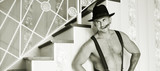 Muscular macho in a felt hat black and white photo