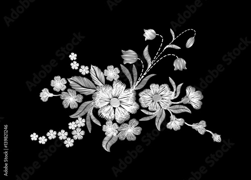 Embroidery white wild flowers on a black background