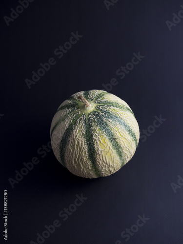 Cantaloupe melon isolated on dark background