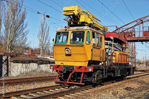 Railway track service car fixing and repairing the railroad.