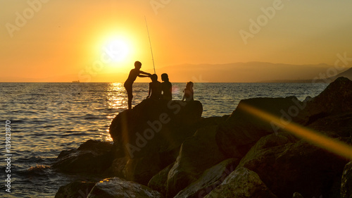  Fishing at sunset in the Camogli, Italy