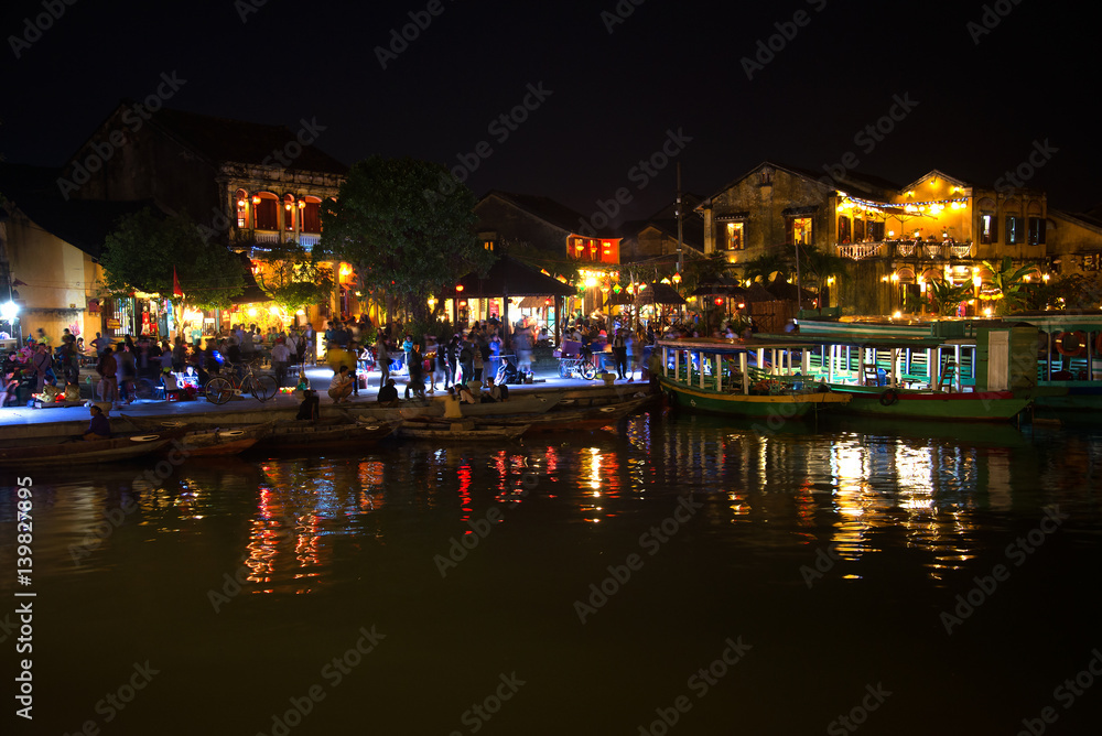 Late evening on the embankment of the old city. Hoi An, Vietnam