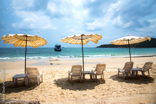 Fototapeta Naklejka Na Ścianę i Meble -  White umbrellas in cloudy day on beautiful beach at Samed island, Thailand