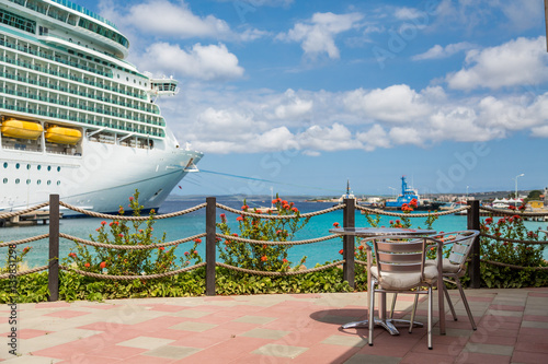 Table on Restaurant Patio with Cruise Ship in Background