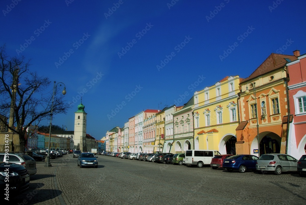 Main Smetana town Square in Litomysl, Pardubice Region, Czech Republic. Elongated street with baroque, classical and empire style facades of houses and arcades.