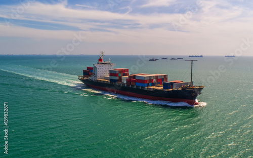 container ship in import export and business logistic.By crane ,Trade Port , Shipping.cargo to harbor.Aerial view.Top view.