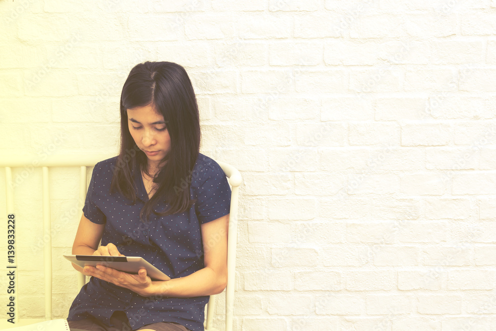 young asian woman internet on mobile phone during rest in coffee shop young asian woman internet on mobile phone during rest in coffee shop