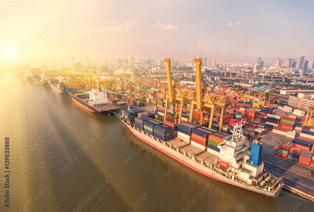 Naklejka premium container ship in import export and business logistic.By crane ,Trade Port , Shipping.cargo to harbor.Aerial view.Top view.