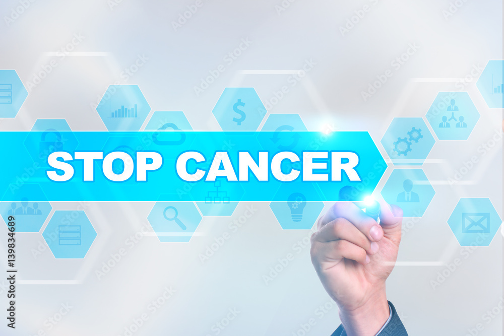 Medical doctor drawing stop cancer on the virtual screen. Medical doctor drawing stop cancer on the virtual screen.