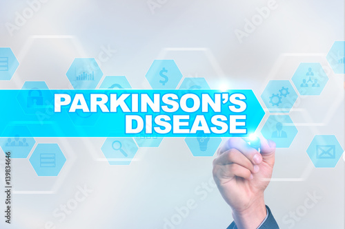 Medical doctor drawing parkinson?s disease on the virtual screen.