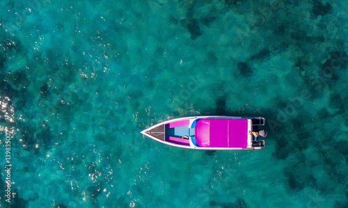 Speed boat in the sea.Aerial view. Top view.amazing nature background.The color of the water and beautifully bright. © MAGNIFIER