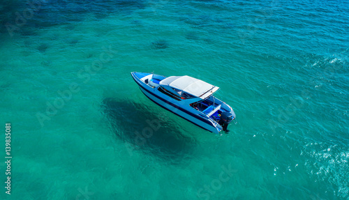 Speed boat in the sea.Aerial view. Top view.amazing nature background.The color of the water and beautifully bright.