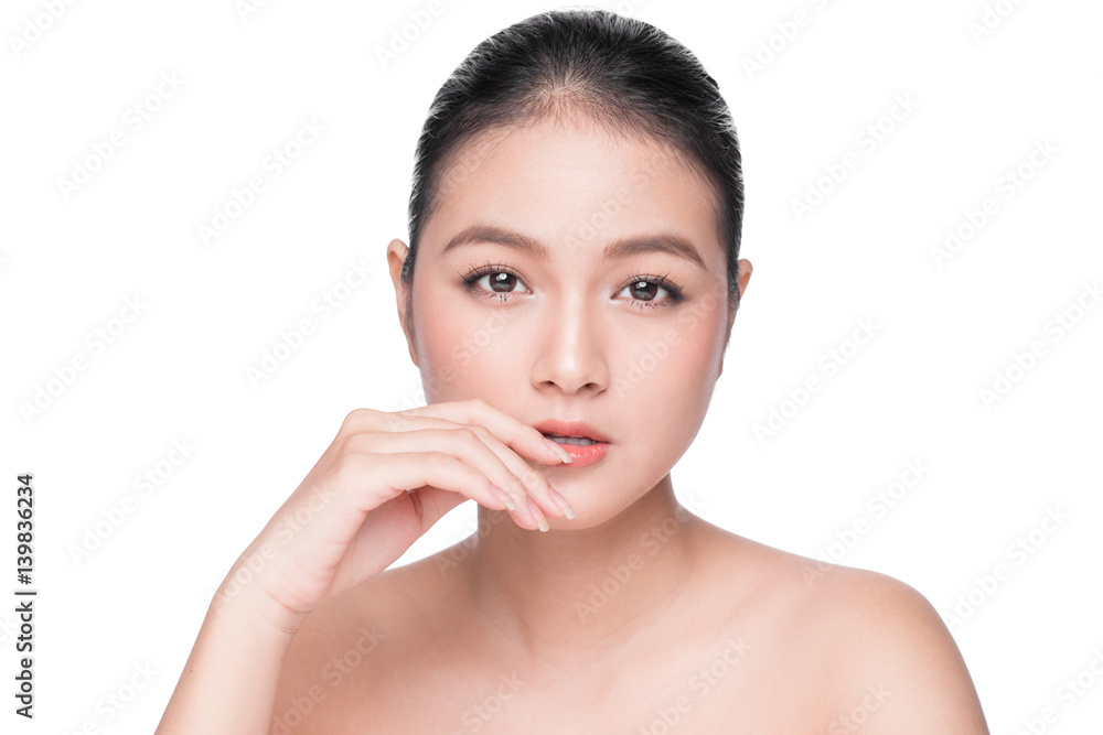 Skin care. Beautiful Young Asian Woman with Clean Fresh Skin touch her face