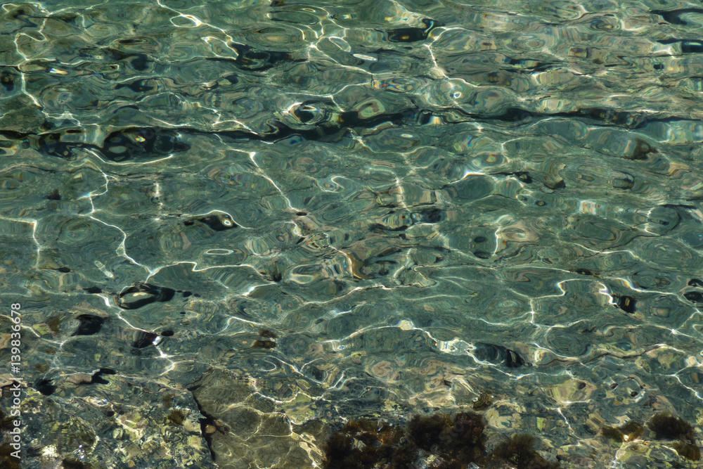 Dazzling pebbles under the waters of Mediterranean sea. Creta, Greece. Dazzling pebbles under the waters of Mediterranean sea. Creta, Greece.