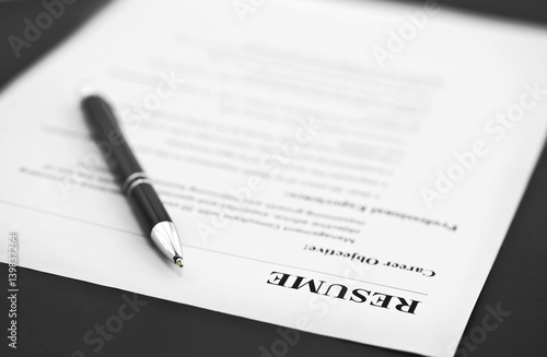 Closeup of Resume with Pen on the Table 