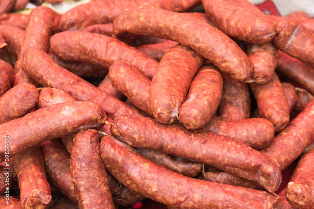 bunch of smoked spicy sausages on the market bunch of smoked spicy sausages on the market