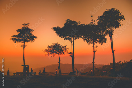 sunset with silhouette forest and colorful sky