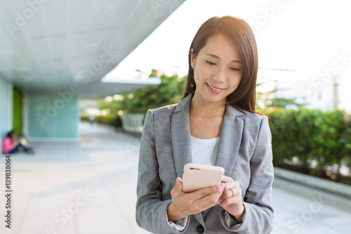 Photography Business woman texting on cellphone