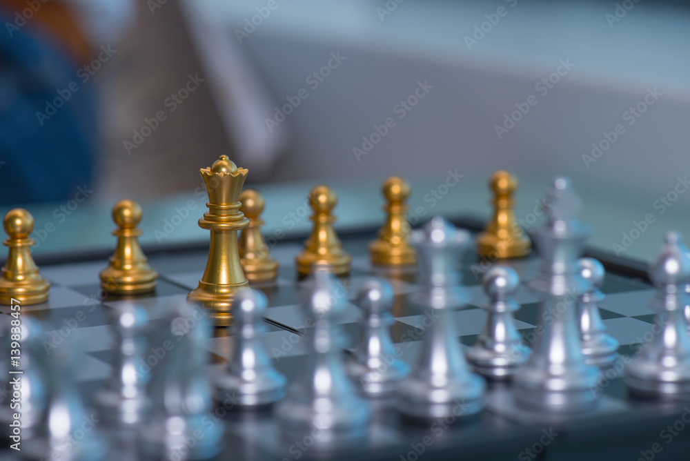 Woman's hand pick up chess pieces Woman's hand pick up chess pieces