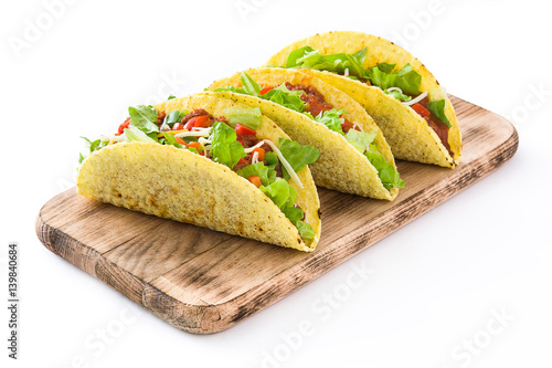 Traditional Mexican tacos with meat and vegetables, isolated on white background
