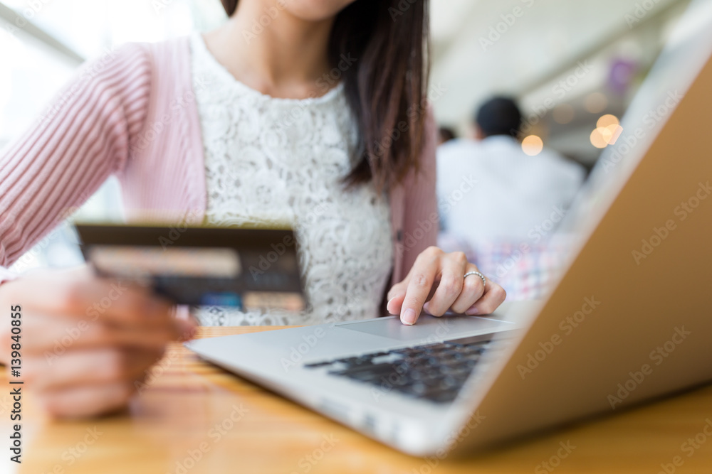 Woman shopping with credit card and laptop computer Woman shopping with credit card and laptop computer
