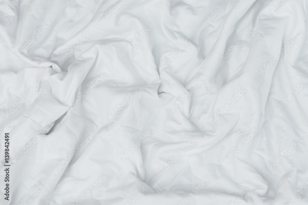 Fototapeta premium Crumpled White Bedspread Soft Fabric Textured Background