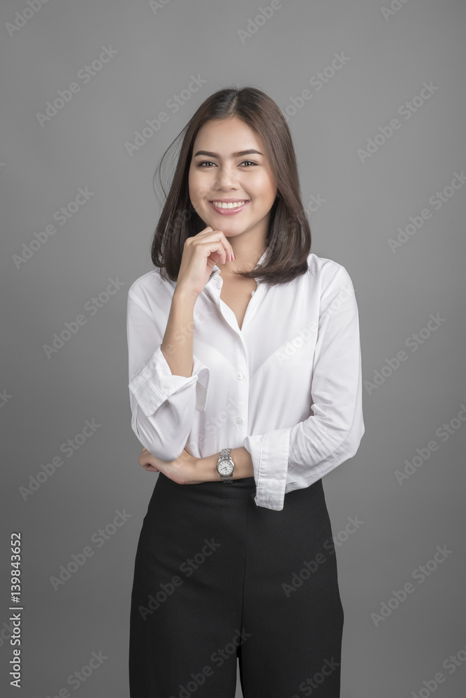 Beautiful Business Woman smiling on grey background Beautiful Business Woman smiling on grey background