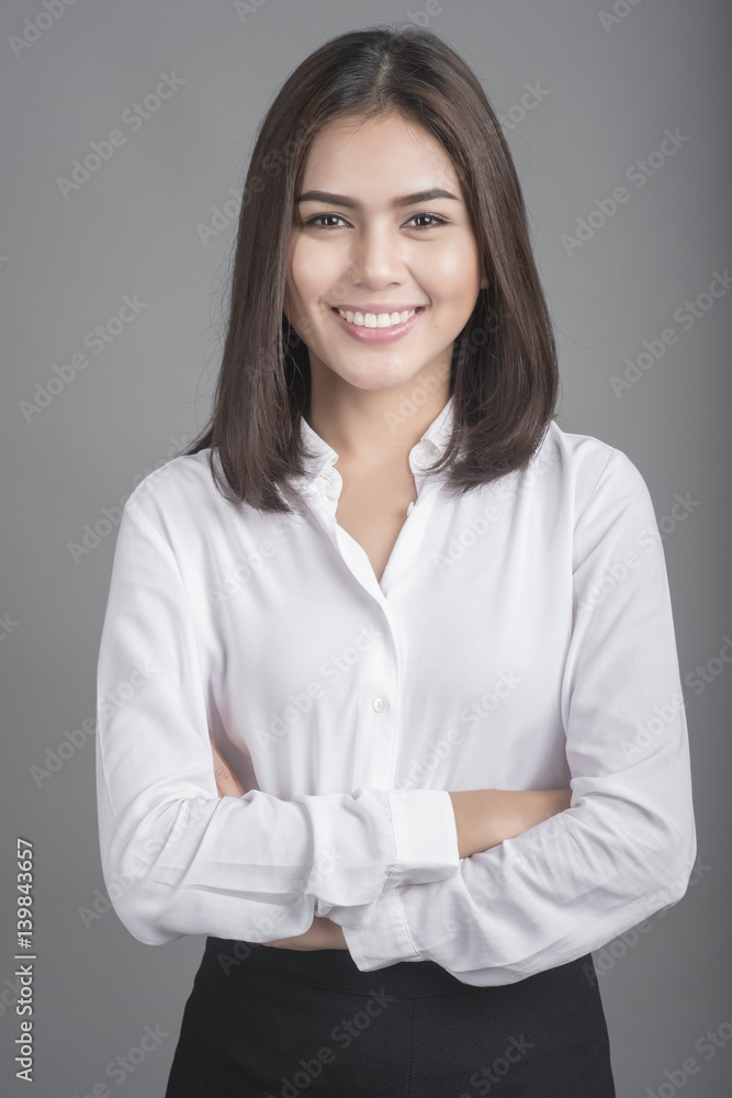 Beautiful Business Woman smiling on grey background Beautiful Business Woman smiling on grey background