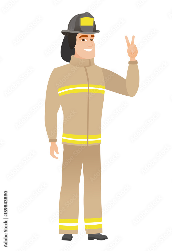 Caucasian firefighter showing the victory gesture.
