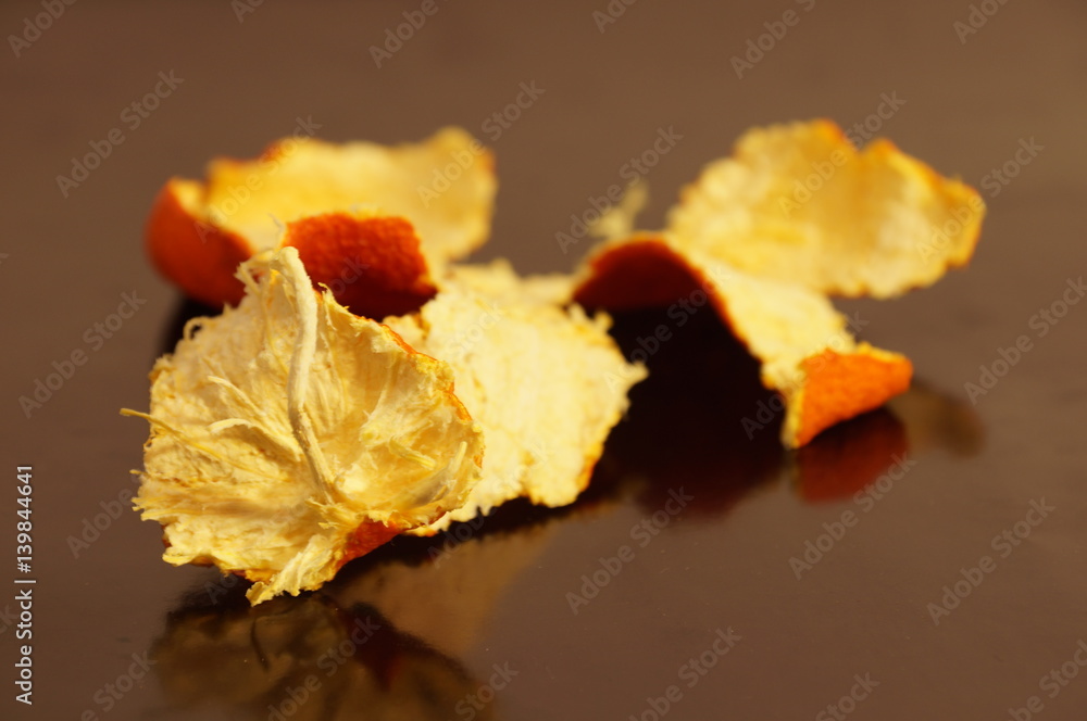 Mandarin crust is dried and isolated on a monophonic background. Zedra on the background Mandarin crust is dried and isolated on a monophonic background. Zedra on the background