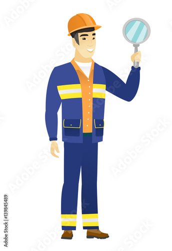 Asian builder holding hand mirror.