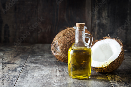 Coconut oil on wooden background
